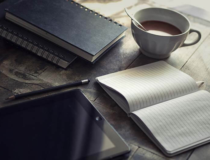 notes and coffee on a table